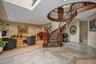 Stairs featuring recessed lighting and a high ceiling