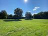View of green lawn featuring a rural view