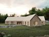 Back of house with a lawn