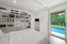 Unfurnished bedroom featuring wood finished floors, access to outside, and recessed lighting