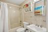 Full bathroom featuring tile walls and shower / bath combo