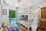 Bedroom featuring wood finished floors, access to exterior, and recessed lighting