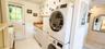 Laundry room with estacked washer and dryer and cabinet space