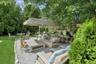 View of patio with an outdoor living space, outdoor dining space, and view of scattered trees