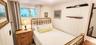 Bedroom with wood walls