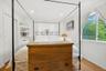 Bedroom with wood finished floors and recessed lighting