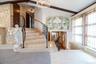 Entryway 2nd Floor Foyer with a chandelier, and stairway.