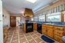 Large Kitchen with Blue Granite Counters.