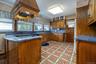 Large Kitchen with multi-color Ceramic Floor.