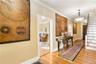 Hallway featuring stairway, ornamental molding, and hardwood / wood-style floors