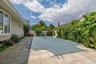 View of pool with a patio area.