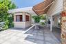 View of Large Rear Granite Patio with automatic Awning.
