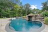 Outdoor pool featuring a patio