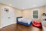 Bedroom featuring wood finished floors, recessed lighting, and a closet