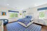 Bedroom featuring dark wood-style floors and recessed lighting