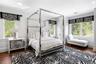 Bedroom featuring dark wood finished floors, multiple windows, and recessed lighting