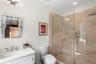 Bathroom featuring a stall shower and vanity