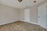 Unfurnished bedroom featuring baseboards, visible vents, and carpet flooring