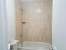 Bathroom with toilet and shower / washtub combination