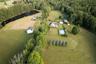 Aerial view of property and surrounding area featuring a large body of water and rural landscape