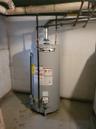Utility room featuring water heater