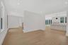 Unfurnished living room with light wood finished floors and recessed lighting