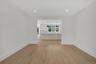Empty room featuring light wood-type flooring and recessed lighting