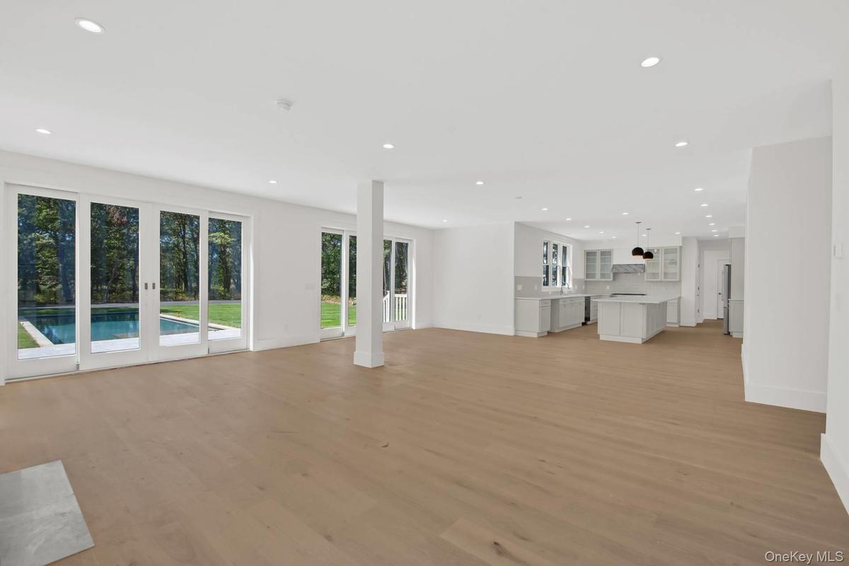 Unfurnished living room featuring recessed lighting and light wood-type flooring