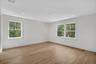 Empty room with light wood-type flooring and recessed lighting
