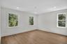 Empty room with healthy amount of natural light, recessed lighting, and light wood-style flooring