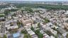 View of property location with nearby urban area