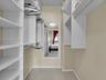 Walk-in closet with great space and cabinetry.
651 Okeechobee Blvd., Unit #1002, West Palm Beach, FL.  City Place Tower Condominium. For Sale.