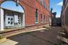 View of side of property featuring brick siding