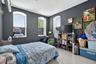 Bedroom featuring finished concrete flooring