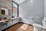 Bathroom featuring toilet and finished concrete flooring