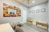 Home office featuring wood finished floors and a ceiling fan