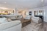 Living room with french doors and hardwood / wood-style flooring