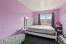 Bedroom with dark carpet