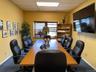 Carpeted office featuring baseboards and a drop ceiling