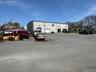 View of parking with a garage