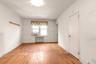 Unfurnished room with light wood finished floors and baseboards