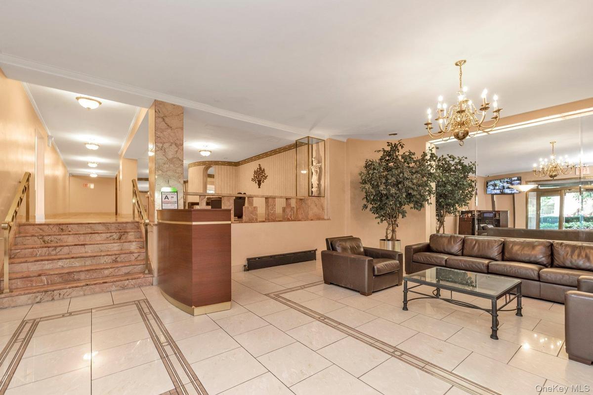 Welcome area featuring stairs and a chandelier
