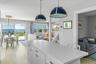 Spacious island with breakfast bar seating, ideal for casual dining and entertaining.