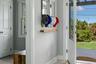 Inviting entry opens to light-filled, open concept main living.