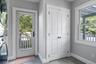 Spacious laundry room with access to outdoor shower.