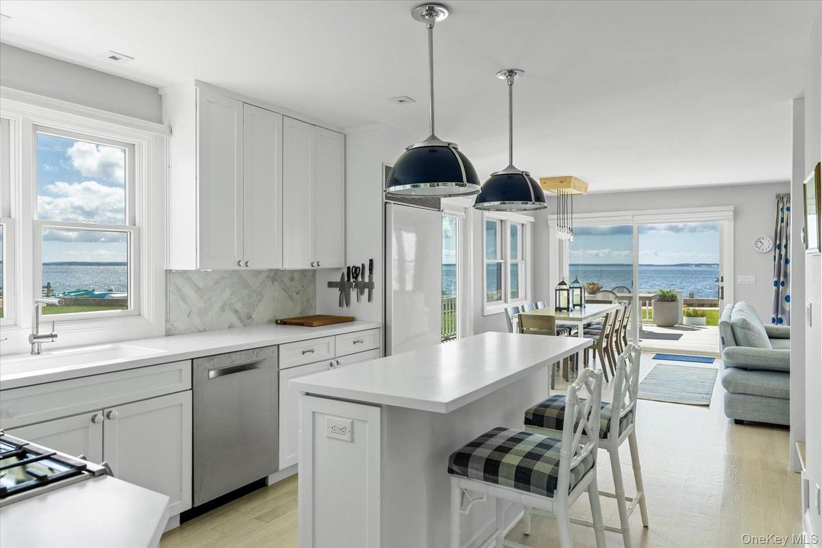 Cook and entertain while enjoying a surround of windows capturing Peconic Bay and the coastal landscape beyond.
