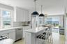 Cook and entertain while enjoying a surround of windows capturing Peconic Bay and the coastal landscape beyond.
