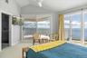 Well appointed primary bedroom with modern fixtures and finishes.