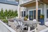 Relax by the fire pit or outdoor dining while enjoying bay views.