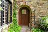 Property entrance featuring stone siding